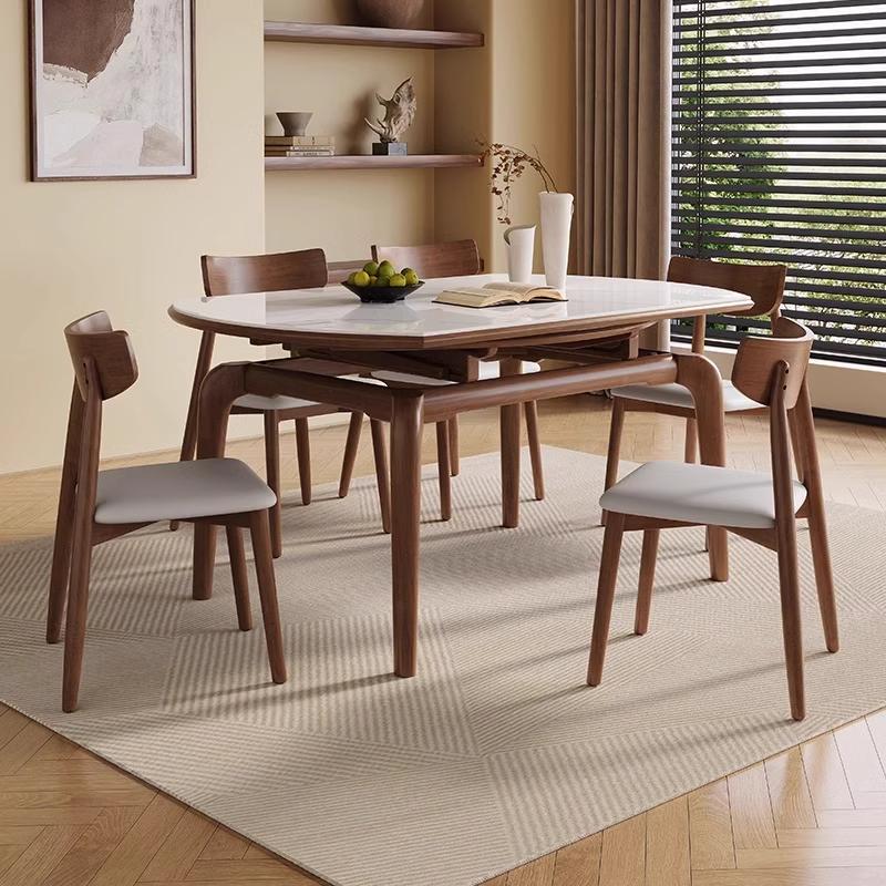 Casual Rounded Extendable Dining Table with Stone Top, Fold-away Leaf, and Chalk Finish